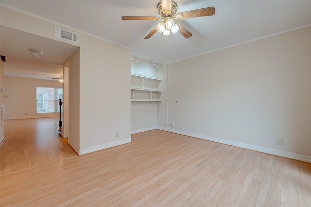 unfurnished room with ceiling fan, light hardwood / wood-style flooring, crown molding, and rail lighting