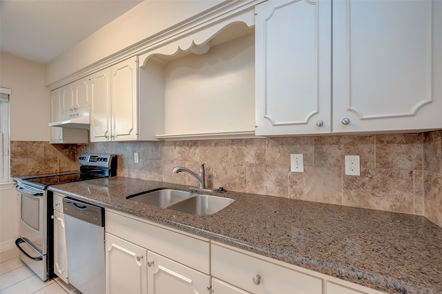 kitchen featuring white cabinetry, backsplash, stainless steel appliances, stone counters, and sink