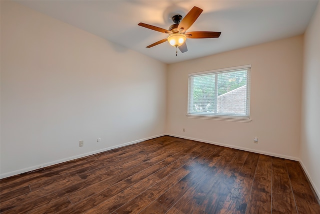 spare room with ceiling fan and dark hardwood / wood-style floors