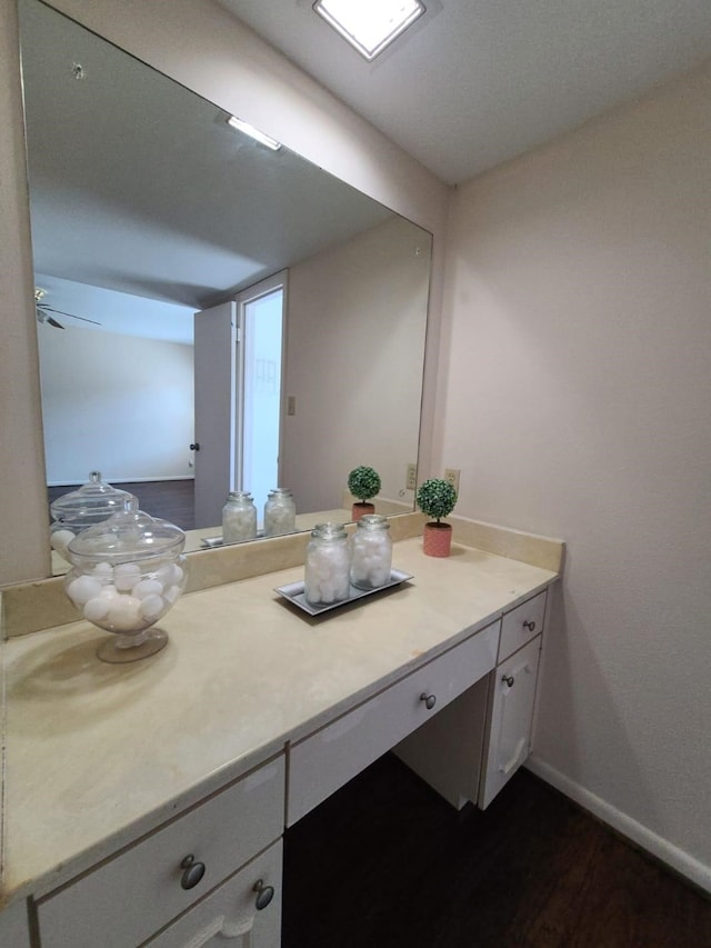 bathroom featuring vanity and hardwood / wood-style flooring