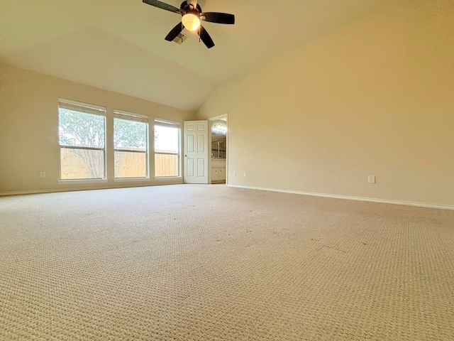 empty room with carpet flooring, ceiling fan, and vaulted ceiling