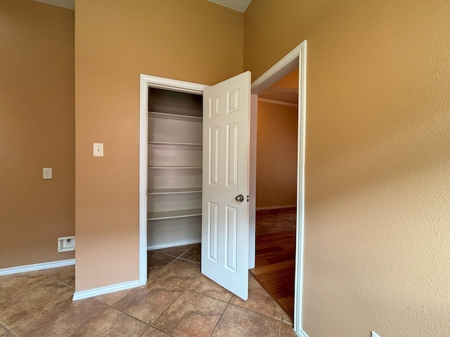 unfurnished bedroom with a closet and wood-type flooring