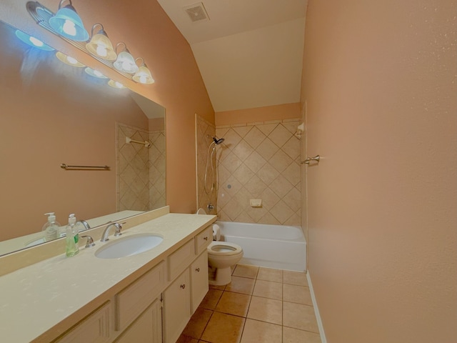 full bathroom with vanity, tile patterned flooring, toilet, lofted ceiling, and tiled shower / bath combo