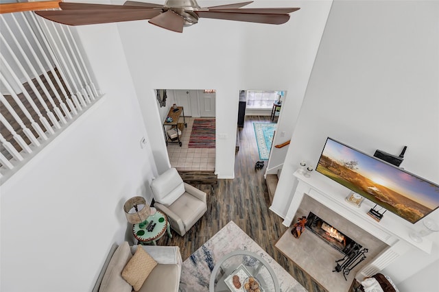 living room with hardwood / wood-style flooring and ceiling fan