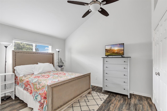 bedroom featuring ceiling fan, a closet, dark hardwood / wood-style floors, and lofted ceiling