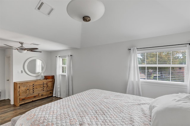 bedroom featuring ceiling fan and dark wood-type flooring