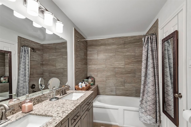 bathroom featuring vanity and shower / tub combo