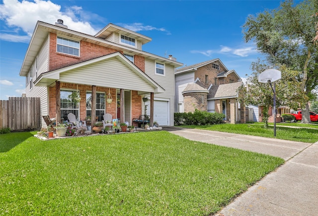 view of front of house featuring a garage, covered porch, and a front lawn