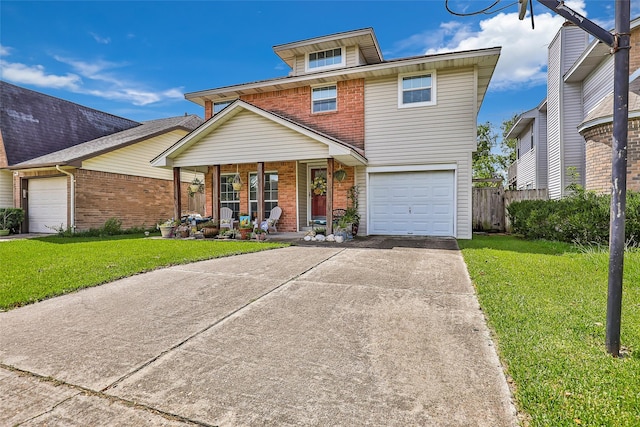 view of front of house with a front lawn, covered porch, and a garage