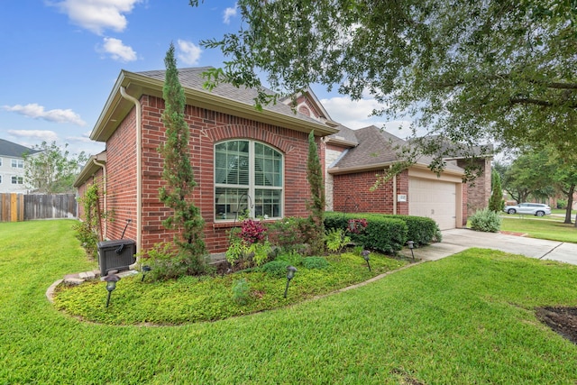 view of front of property with a garage and a front lawn