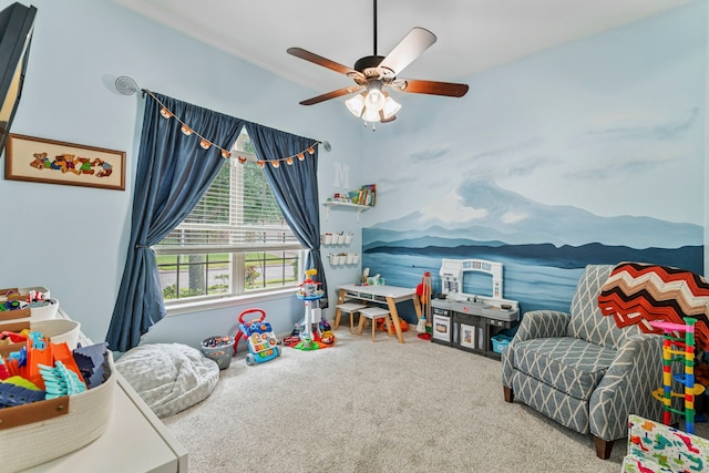 rec room with carpet and ceiling fan