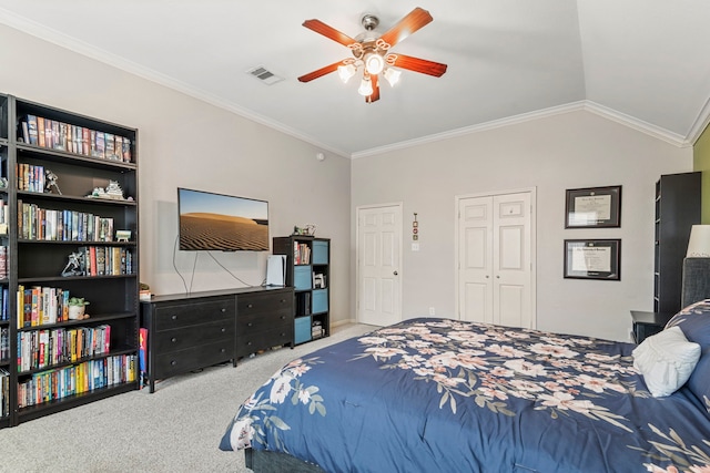 carpeted bedroom with visible vents, a closet, crown molding, ceiling fan, and vaulted ceiling