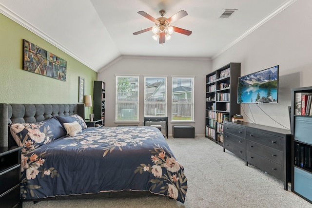 carpeted bedroom with visible vents, ceiling fan, crown molding, and lofted ceiling