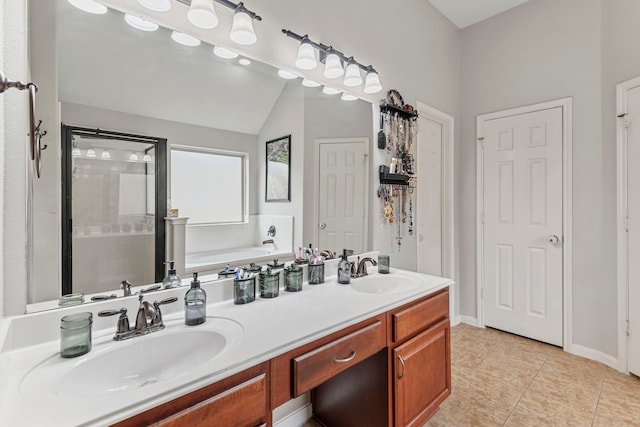 bathroom with a sink, a bath, tile patterned floors, and a tile shower