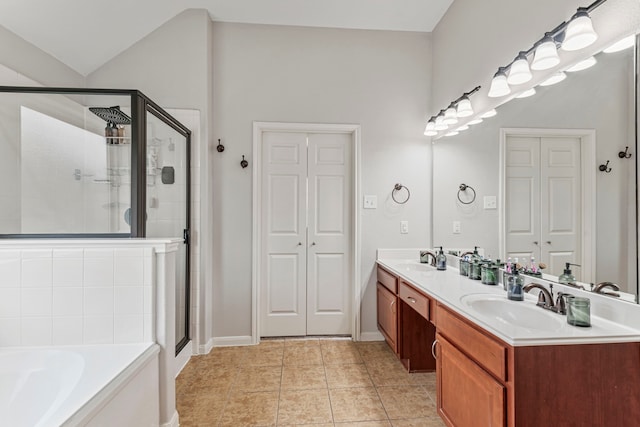 full bathroom with a garden tub, a stall shower, a closet, and a sink