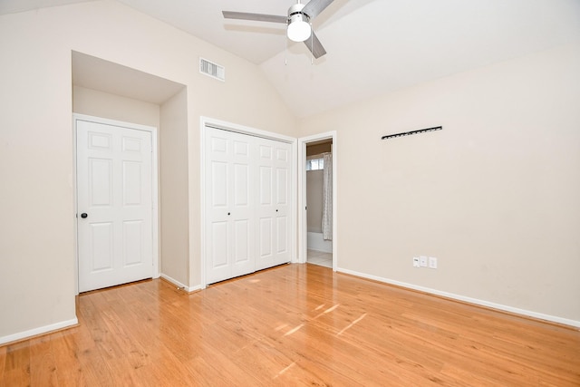 unfurnished bedroom with a closet, lofted ceiling, ceiling fan, and light hardwood / wood-style flooring