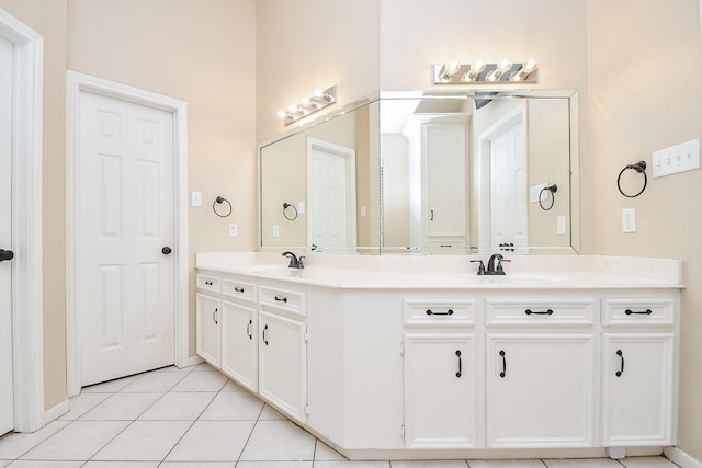 bathroom with vanity and tile patterned flooring