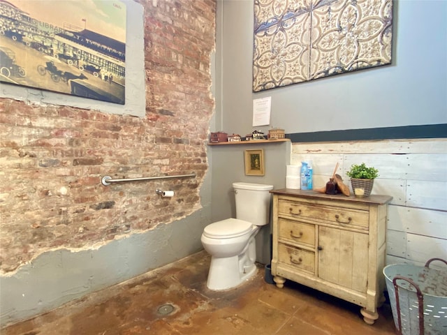 2127 Broadway St, Galveston, TX 77550 - bathroom with toilet and brick wall