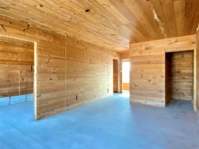 2127 Broadway St, Galveston, TX 77550 - empty room featuring wood walls, wood ceiling, and finished concrete floors
