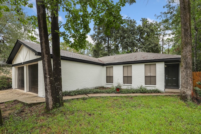 view of front facade with a front lawn and a garage