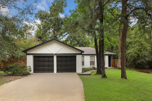 ranch-style home featuring a garage and a front yard