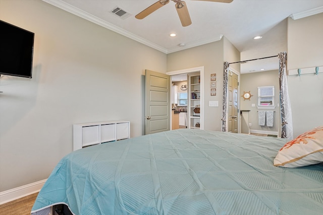 bedroom with ornamental molding, hardwood / wood-style flooring, and ceiling fan