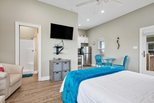 bedroom featuring light wood-type flooring, stainless steel fridge, and ceiling fan