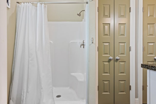 bathroom with a shower with shower curtain