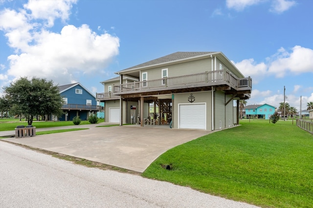 view of front facade with a garage, a front lawn, and a deck