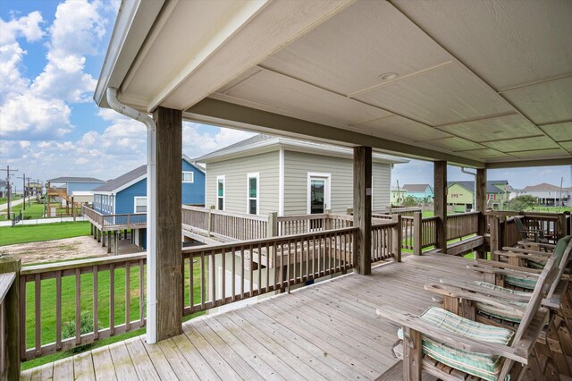 wooden deck with a yard