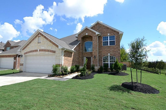 view of property with a front lawn and a garage