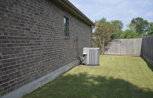 view of yard featuring central AC