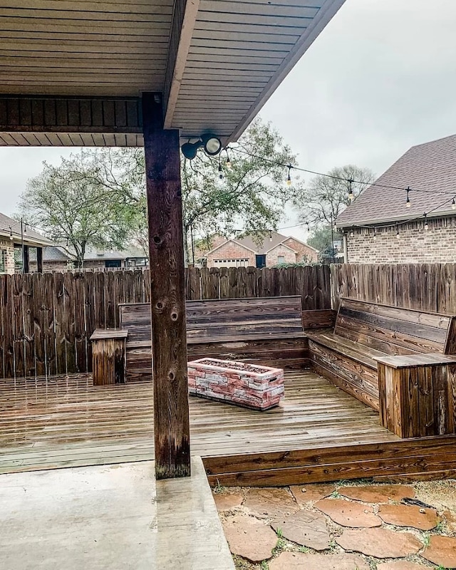 wooden deck with a patio