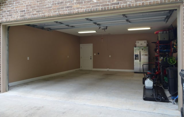 garage with stainless steel fridge