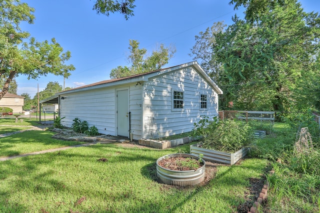 view of outbuilding with a lawn