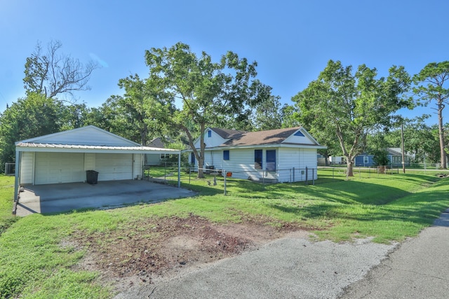 ranch-style home featuring cooling unit, an outdoor structure, a front yard, and a garage