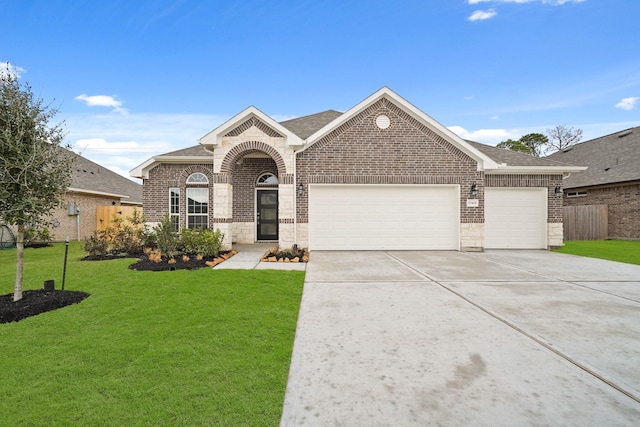 single story home with a garage and a front yard