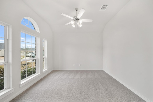 unfurnished room with vaulted ceiling, carpet floors, and ceiling fan