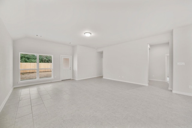 empty room with lofted ceiling