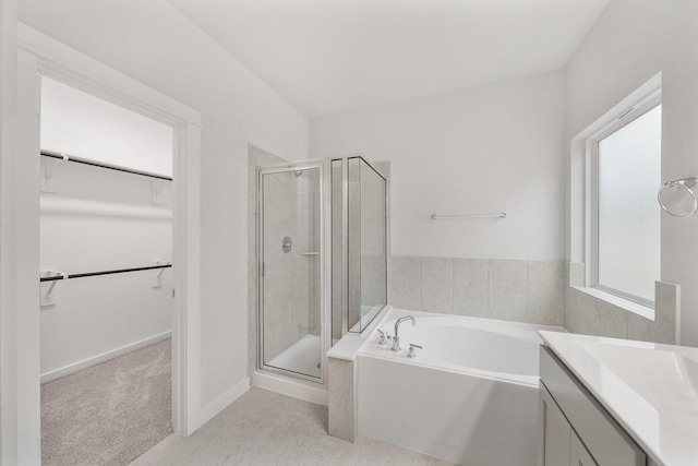 bathroom with vanity, vaulted ceiling, tile patterned floors, and independent shower and bath