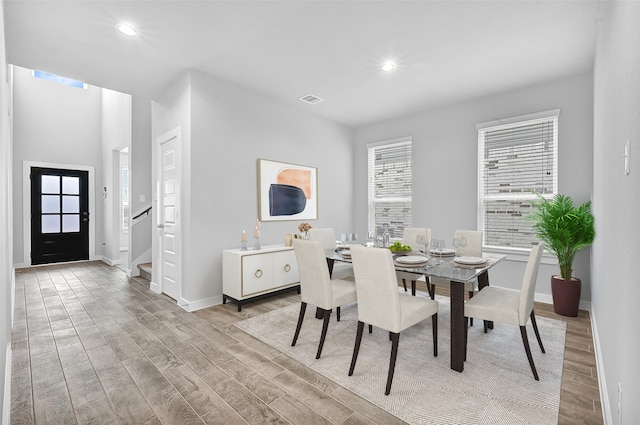 dining space with light wood-type flooring