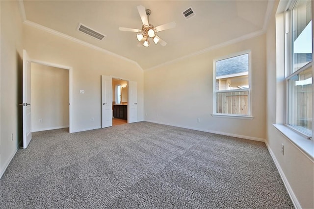 unfurnished bedroom with ornamental molding, carpet, and ceiling fan