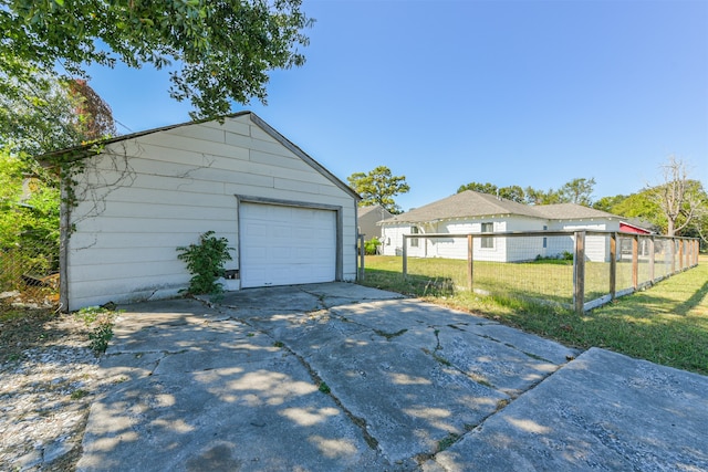 garage featuring a yard