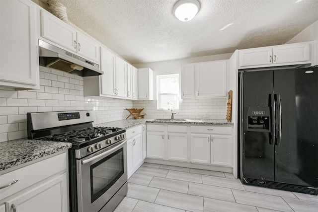 kitchen featuring white cabinets, black refrigerator with ice dispenser, and gas range