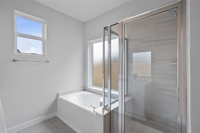 bathroom with shower with separate bathtub