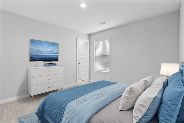 bedroom featuring recessed lighting, light carpet, visible vents, and baseboards