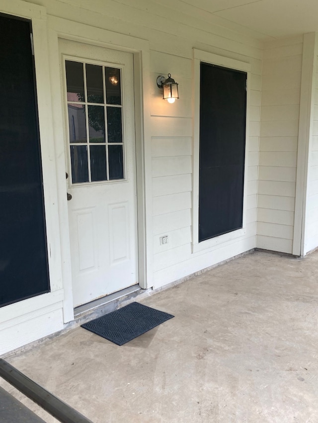 doorway to property featuring a patio area