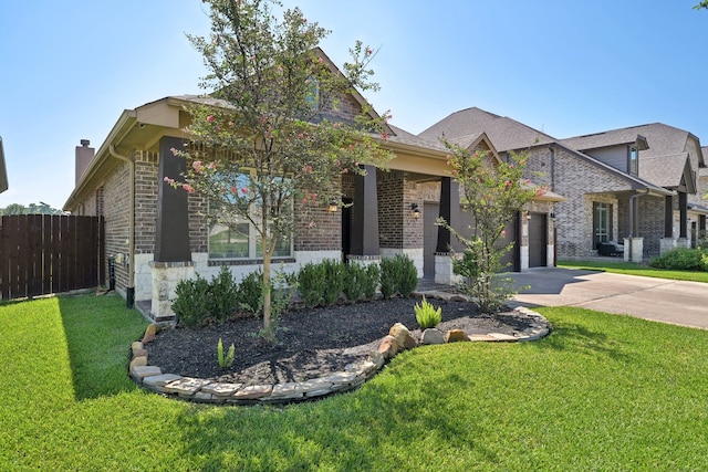 view of front facade with a garage and a front lawn