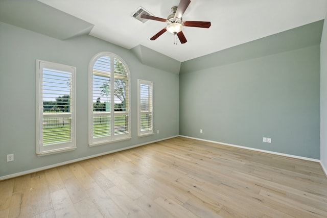 empty room with ceiling fan and light wood-type flooring