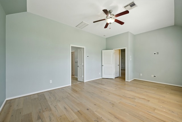 unfurnished bedroom with ceiling fan, lofted ceiling, and light wood-type flooring